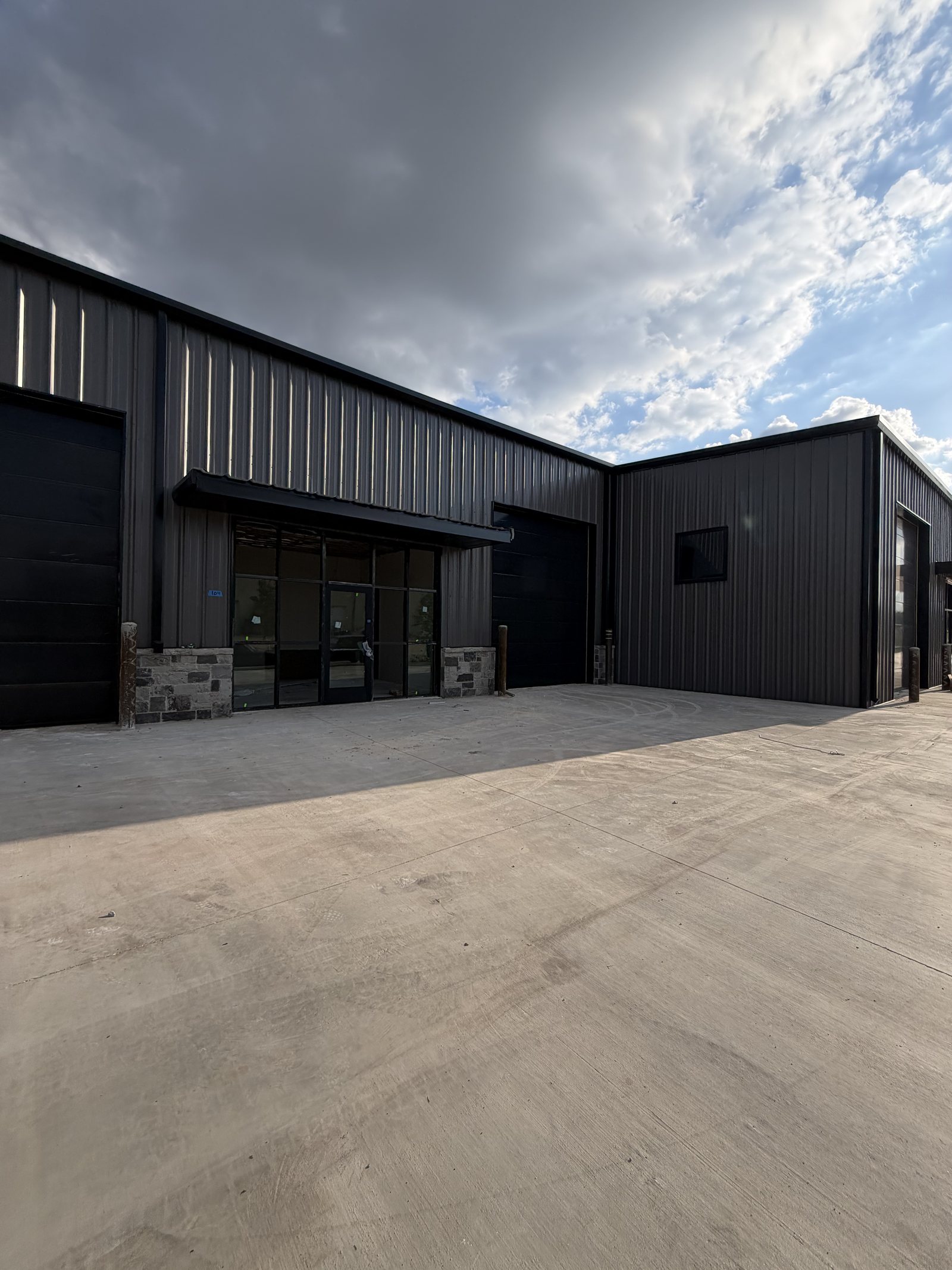 Completed dark-metal commercial building, Grand Prairie Texas