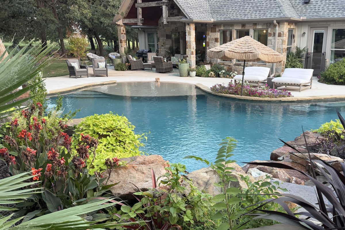 Custom stone and timber home with pool and covered outdoor living
